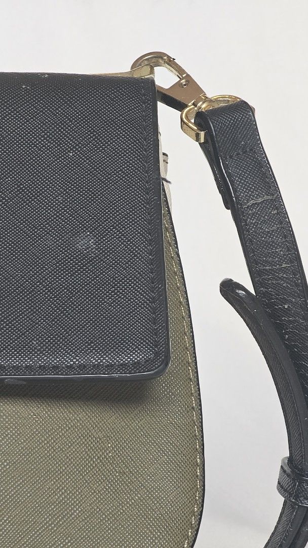 Kate Spade Colorblock Crossbody Bag (Category: Cross-body Bags) located in Quezon. Submitted by cgmhe (Listing ID 1464823247, Image 3). Description: - Brand: Kate Spade - Style: Crossbody bag with adjustable black strap - Design: Chic colorblock in black, olive green, and cream - Material: Saffiano textured leather with gold-tone hardware and front logo lettering - Condition: Pre-loved with flaws (cracking along strap edges, paint peeling spots o