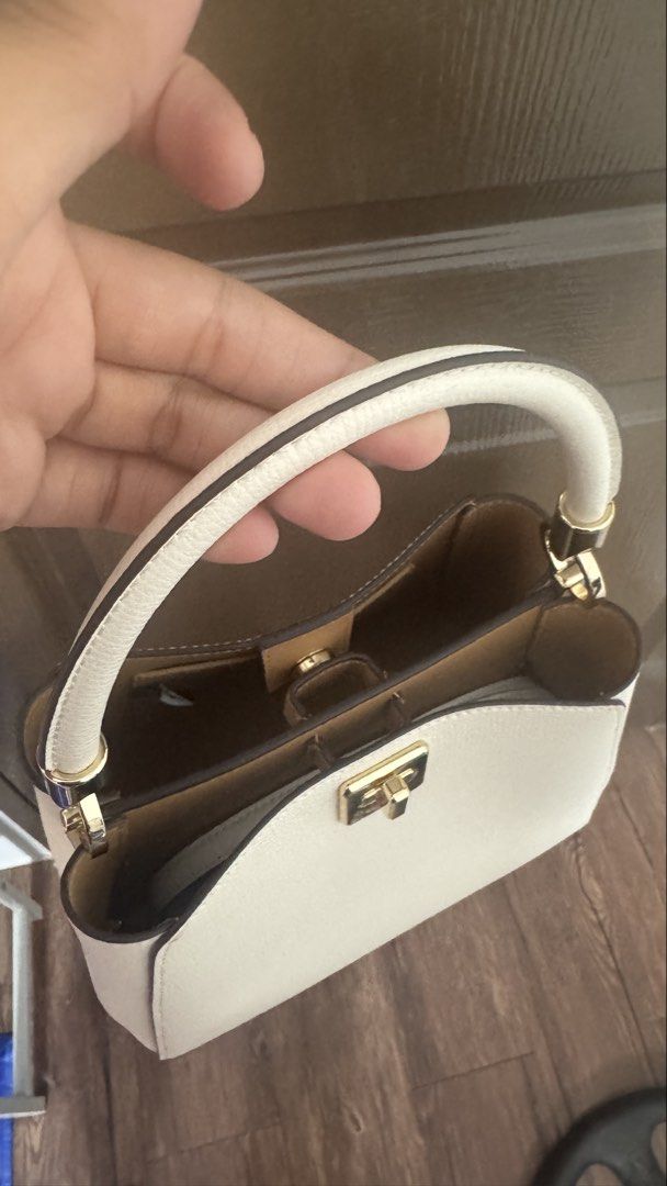 Kate Spade Phoebe Small Top Handle Bag (Category: Luxury Bags & Wallets) located in Imus. Submitted by jahnapilot (Listing ID 1464942822, Image 2). Description: AUTHENTIC Kate Spade Phoebe Small Top Handle Bag (KF553) - Pristine/Never Used • Color: Meringue; Size: Small • Condition: Brand New / Unused (No Tags/original dust bag) Comes with alternative dust bag • Description: Selling an authentic, never-been-used Kate Spade Phoebe Small Top Handle