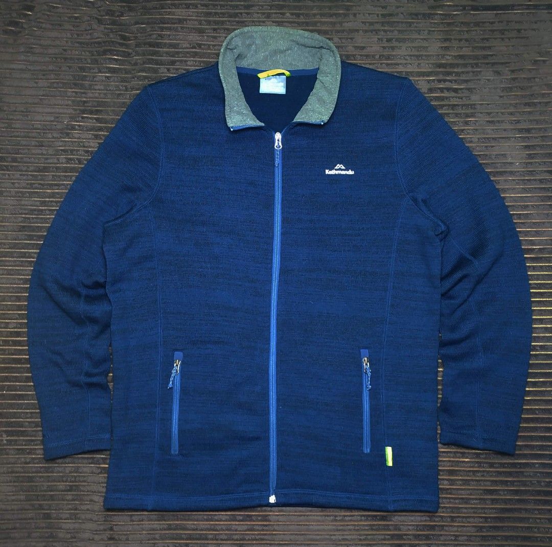 Kathmandu Blue Fleece Jacket XL (Category: Coats, Jackets and Outerwear) located in Manila. Submitted by norathrifted (Listing ID 1464801619, Image 1). Description: - Brand: Kathmandu - Style: Full-zip fleece jacket - Color: Deep blue with grey ribbed inner collar - Logo: White embroidered on chest - Pockets: Two secure zipped side pockets with blue pull cords - Size: XL - Condition: Warm fleece material, perfect outer layer for cold weather.