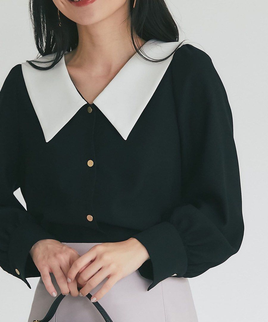 Knitted Black Good Button Polo Sweater (Category: Longsleeves) located in Binan City. Submitted by myprelovedhaul (Listing ID 1464933549, Image 1). Description: This black-and-white contrast collar knit top features elegant pearl-style buttons and sheer sleeves..