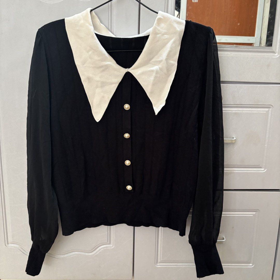 Knitted Black Good Button Polo Sweater (Category: Longsleeves) located in Binan City. Submitted by myprelovedhaul (Listing ID 1464933549, Image 2). Description: This black-and-white contrast collar knit top features elegant pearl-style buttons and sheer sleeves..