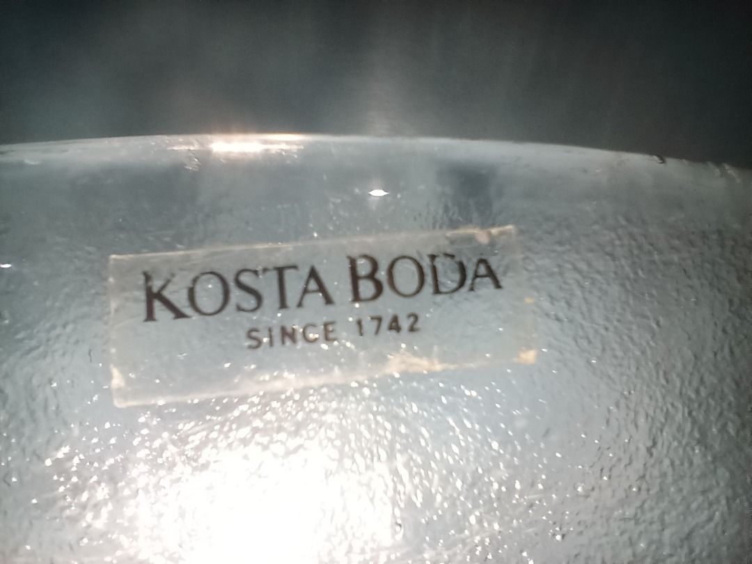 Kosta Boda Glass Fish Serving Platter (Category: Dinnerware & Cutlery) located in Munoz. Submitted by larryc1212 (Listing ID 1464898069, Image 2). Description: - Authentic Kosta Boda art glass platter - Features a detailed, embossed fish design on the underside with clear textured glass - Measures approximately 12 inches in diameter - Original manufacturer sticker still attached near the rim - Heavy, premium quality piece - Ideal for serving seaf