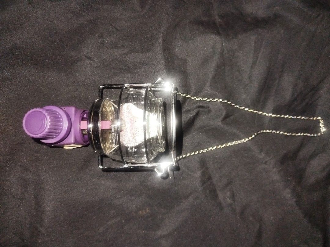 Kovea Gas Lantern with Hanging Chain (Category: Lighting) located in Manila. Submitted by jojo.welter (Listing ID 1464904554, Image 1). Description: - Brand: Kovea - Glass Globe: Genuine Schott Suprax (Made in Germany) - Features: Protective metal wire cage, stylish purple control knob, and twisted silver hanging chain - Compatibility: Screws directly onto standard camping gas canisters via brass valve - Excellent condition -Brand new never use.