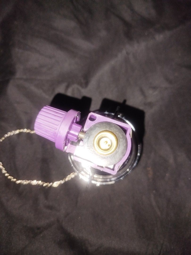 Kovea Gas Lantern with Hanging Chain (Category: Lighting) located in Manila. Submitted by jojo.welter (Listing ID 1464904554, Image 2). Description: - Brand: Kovea - Glass Globe: Genuine Schott Suprax (Made in Germany) - Features: Protective metal wire cage, stylish purple control knob, and twisted silver hanging chain - Compatibility: Screws directly onto standard camping gas canisters via brass valve - Excellent condition -Brand new never use.