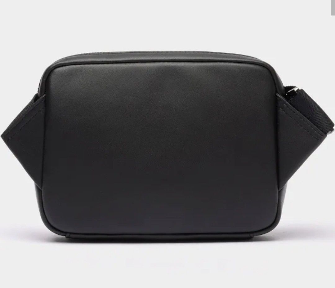 Lacoste bag for men (Category: Belt bags, Clutches and Pouches) located in Manila. Submitted by eliphalet_983 (Listing ID 1464831179, Image 2). Description: lacoste men leather monogram print. original brand new with dust bag and box payment first cashG loc. Pasig delivery fee shoulder by the buyer salamat po.