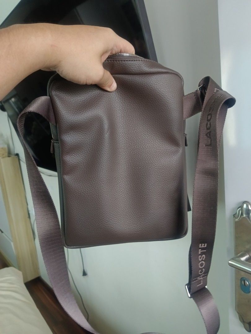 Lacoste Brown Leather Crossbody Bag (Category: Sling Bags) located in Mandaluyong City. Submitted by ralfmadrilejos (Listing ID 1464795868, Image 2). Description: - Authentic Lacoste crossbody bag in brown pebbled leather brand new! pick up or shipping only Lancaster general trias lalamove or shipping only pass sa barat brand new ito rfs too many bags.