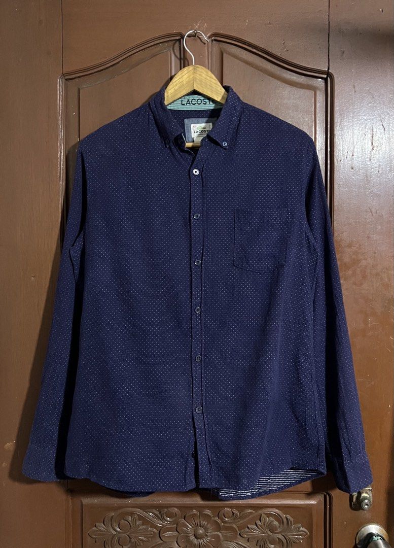 Lacoste Navy Blue Button Down Longsleeves (Category: Tshirts & Polo Shirts ) located in Manila. Submitted by thriftpoint99 (Listing ID 1464888495, Image 1). Description: 21.5x26.5-29.5 No issue Excellent condition.