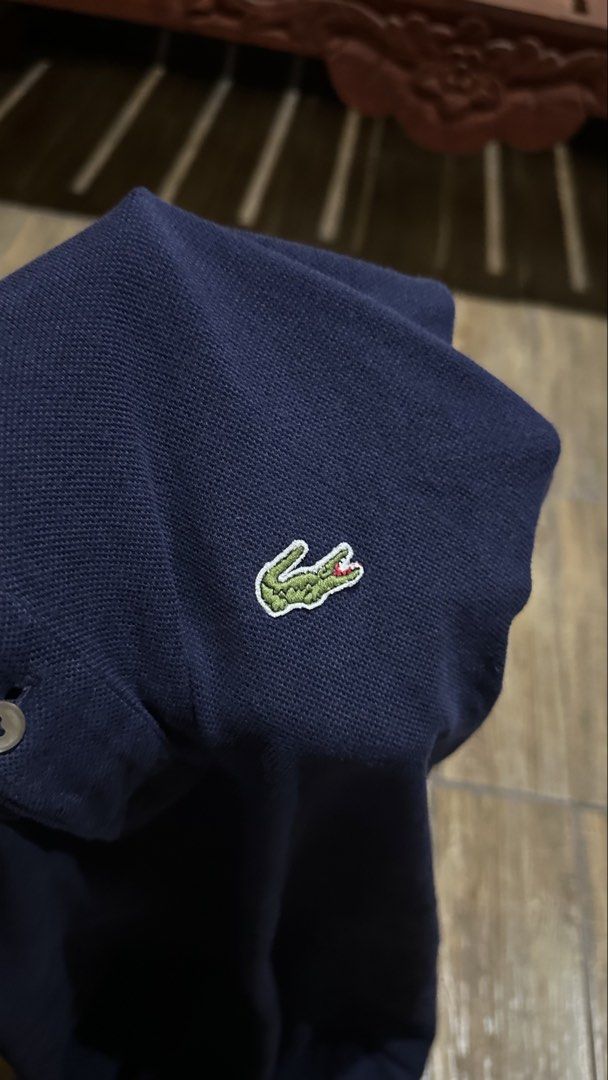 LACOSTE NAVY BLUE POLO (Category: Tshirts & Polo Shirts ) located in Manila. Submitted by urban-vintage_2 (Listing ID 1464929622, Image 2). Description: ISSUE: SEE THE PICS FOR ISSUE ( NEED WASH ) MOP :GCASH ( NO COD ) SHIP VIA : LALAMOVE & J&T LOCATION : PASIG CITY LENGTH : 32 WIDTH : 24 .