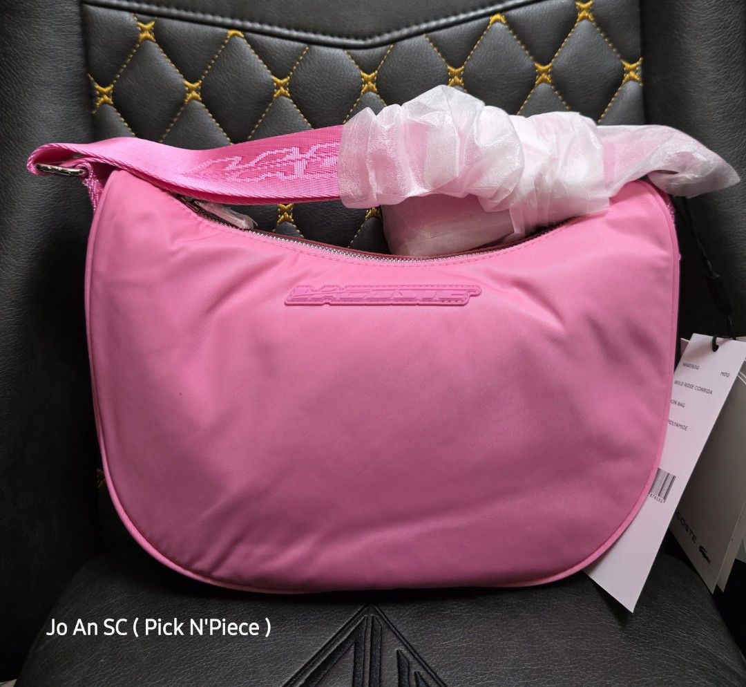 LACOSTE PINK-NYLON CROSSBODY BAG (Category: Luxury Bags & Wallets) located in Quezon City. Submitted by joansc (Listing ID 1464945740, Image 1). Description: SOURCED: SOUTH KOREA 100% ORIGINAL ONLY W/TAG, POLYPLASTIC.