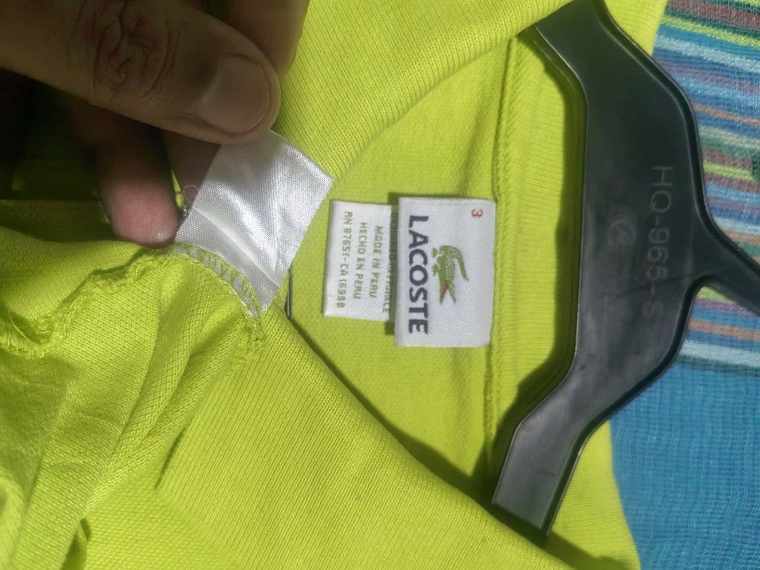 Lacoste polo shirt (Category: Tshirts & Polo Shirts ) located in Vinzons. Submitted by kspabico07187 (Listing ID 1464921936, Image 3). Description: Verygood condition No stain L-27 W-19.5 Need wash fresh from bale.