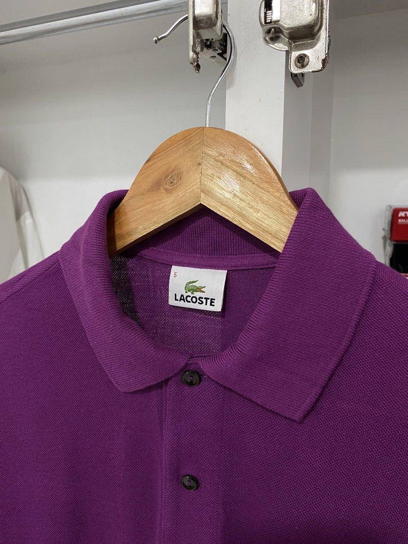 Lacoste Purple Polo Shirt Size 5 Devanlay (Category: Tshirts & Polo Shirts ) located in Talisay. Submitted by locsinsteven (Listing ID 1464837406, Image 2). Description: - Brand: Lacoste (by Devanlay) - Color: Purple (Solid) - Size: 5 - Material: 100% Cotton - Features: Classic collar with 2 front buttons, short sleeves, iconic green crocodile logo on the chest - Condition: Excellent pre-loved / quality assured - Mode of Payment: GCash, BPI, or B