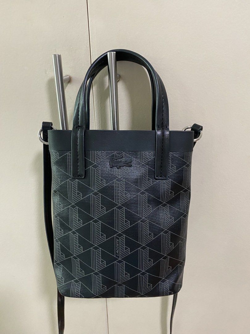 Lacoste Zely Canvas Monogram mini tote (preloved) (Category: Luxury Bags & Wallets) located in San Juan City. Submitted by rostorres (Listing ID 1464817279, Image 1). Description: LAST PRICE posted, no more haggling please 🙏 Item is original, bought from official online store. No issues, please check photos for more details 🙂 Style: Mini bucket bag in black with geometric L monogram pattern Dual top handles, long NOT adjustable and NOT detachab