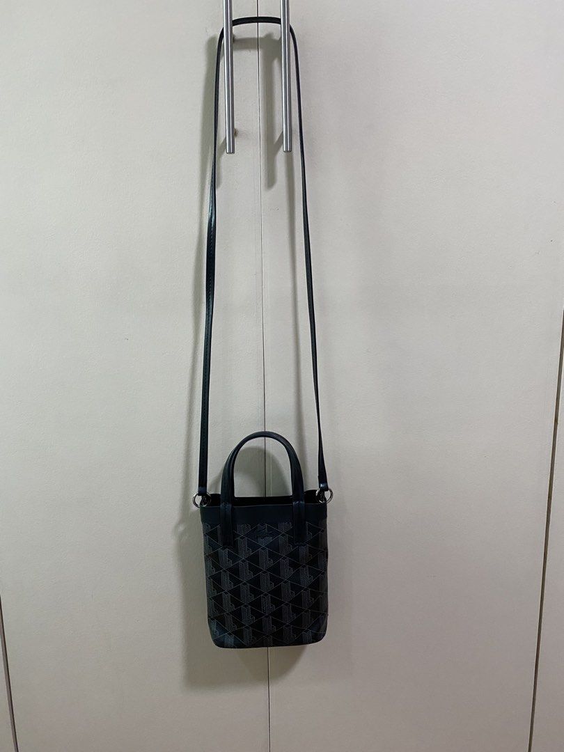Lacoste Zely Canvas Monogram mini tote (preloved) (Category: Luxury Bags & Wallets) located in San Juan City. Submitted by rostorres (Listing ID 1464817279, Image 2). Description: LAST PRICE posted, no more haggling please 🙏 Item is original, bought from official online store. No issues, please check photos for more details 🙂 Style: Mini bucket bag in black with geometric L monogram pattern Dual top handles, long NOT adjustable and NOT detachab