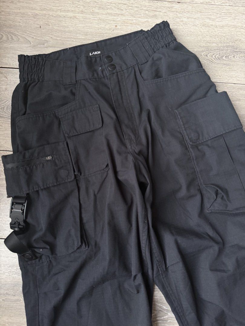 Lakh Black Cargo Pants Technical Trousers (Category: Jeans) located in Legazpi City. Submitted by thefelicitythriftwear (Listing ID 1464828141, Image 3). Description: LAKH Xs on tag Waistline fit to size 30 Length 42 Rise 13 Thigh 14 Hem 9 Excellent Condition Color Rate 9.8/10 No Issue ₱1,580 Disclaimer: This Item of clothing is not affiliated with any of the brands posted or mentioned in this account. All copyright and trademarks are reserved to