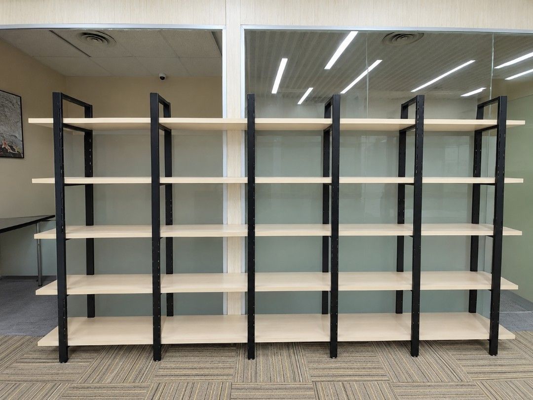 Large Bookshelf Display Rack (Category: Shelves, Cabinets & Racks) located in Singapore. Submitted by youclass (Listing ID 1464846292, Image 1). Description: - 5-tier heavy-duty modular shelving unit - Sturdy black steel frame with light wood-finish shelves - Offers ample open storage space for books, files, or retail display - Sleek industrial design with clean lines - Dimensions: Stands tall and wide (exact measurements available upon request) 
