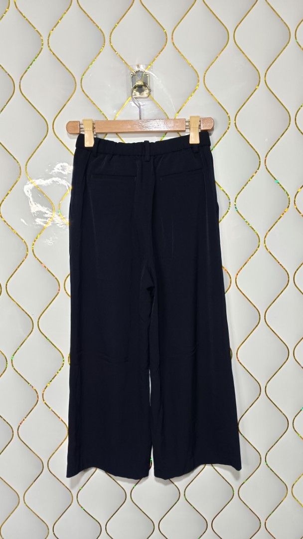 lativ Navy Blue Pleated Culottes (Category: Other Bottoms) located in Manila. Submitted by zariyah.1986 (Listing ID 1464965215, Image 2). Description: - Brand: Lativ - Color: Navy Blue - Size: S - Material: 96% polyester, 4% spandex (100% polyester lining) - Origin: Made in China - Fit: High-waisted with easy pull-on stretch waist - Design: Front pleats, belt loops, and back mock welt pockets - Feel: Lightweight with a comfortable drape.