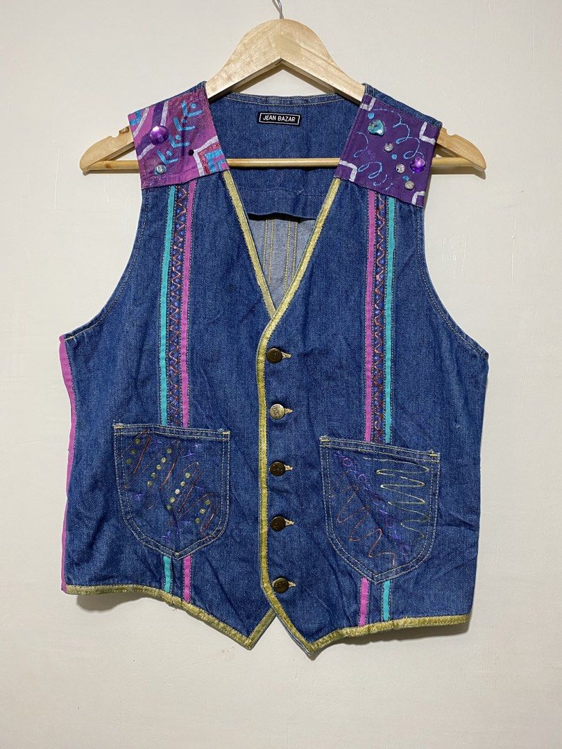 LEE,(Customize Denim vest) (Category: Coats, Jackets and Outerwear) located in Cavite. Submitted by jc_thrift95 (Listing ID 1464802392, Image 1). Description: - This vintage blue denim vest from Jean Bazar features eye-catching purple and turquoise patterned shoulder patches accented with decorative beading and metallic gold trim along the V-neckline. - L- 22.5 inch -W- 19 inch - Color rate 8/10 - See pictures details for dimes..