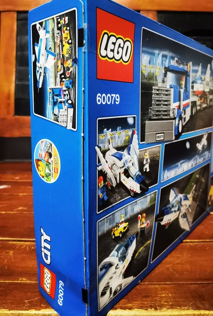 LEGO City Space Transporter Set 60079 (Category: Lego & Building Sets) located in Marikina City. Submitted by ericjannie1206 (Listing ID 1464770041, Image 3). Description: - Set: LEGO City 60079 Training Jet Transporter - Condition: Brand new, factory-sealed box with tape intact - Age Range: 5-12 years - Includes: Big blue truck, flatbed trailer, spaceship, small service cart, and 3 minifigures with tools and gear - Ideal for LEGO City builders a
