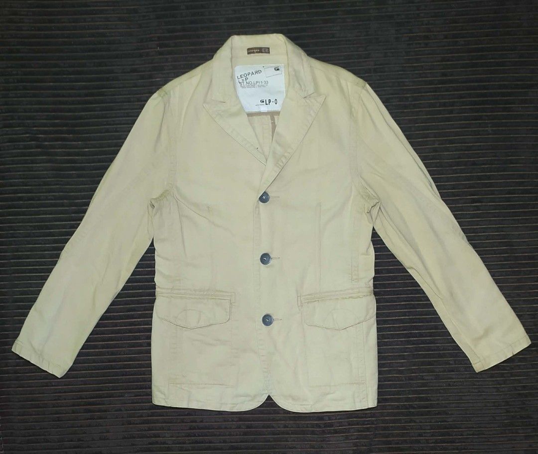 Leopard G-Star Raw Beige Casual Blazer Jacket (Category: Coats, Jackets and Outerwear) located in Manila. Submitted by norathrifted (Listing ID 1464791794, Image 1). Description: - Brand: Leopard by G-Star Raw - Type: Casual blazer jacket - Color: Solid cream beige - Material: 100% Cotton - Closure: Three-button front with embossed Leopard branding - Pockets: Two front flap pockets - Details: Lapel collar, 4-button decorative cuffs, inner style t
