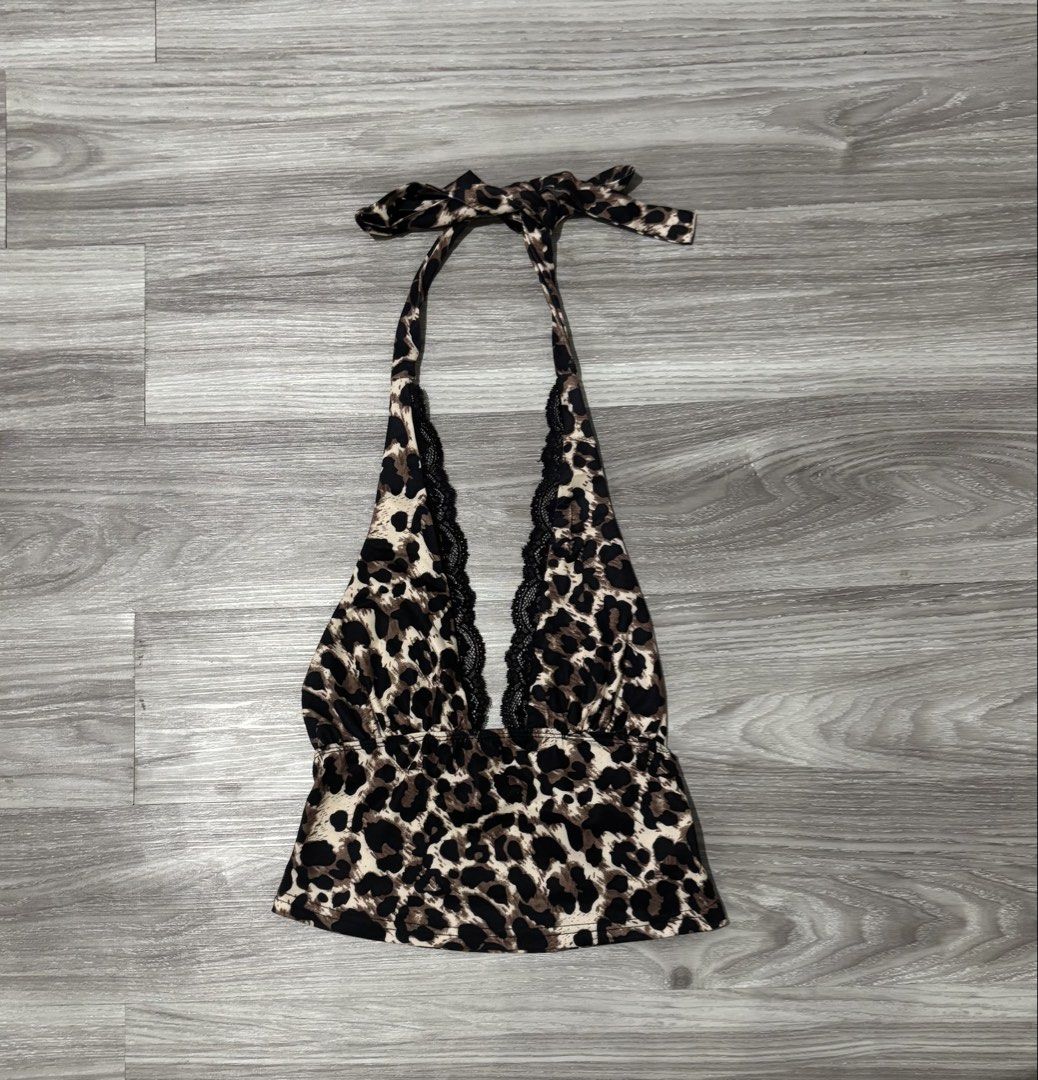 Leopard Print Halter Top with Lace Trim (Category: Sleeveless) located in Tayabas. Submitted by declutterwithmeee29 (Listing ID 1464889507, Image 1). Description: - Leopard print halter top - Black lace trim along the plunging neckline - Ties at the back of the neck with a matching bow - Trendy cropped hemline - Soft and stretchy material for comfort.