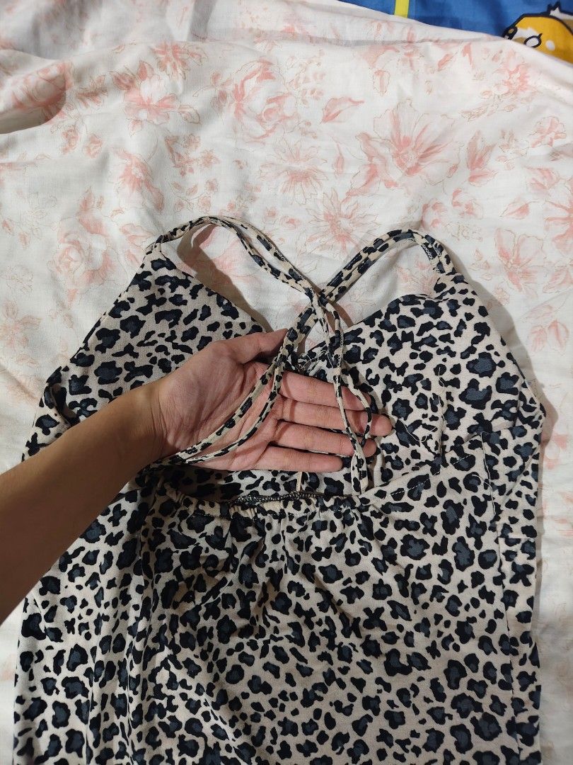 leopard print padded bodycon midi dress (Category: Dresses) located in Bulacan. Submitted by angel.decluttersx (Listing ID 1464878175, Image 3). Description: ww provided s-m no issue stretchable cotton fabric material crisscross spaghetti straps.