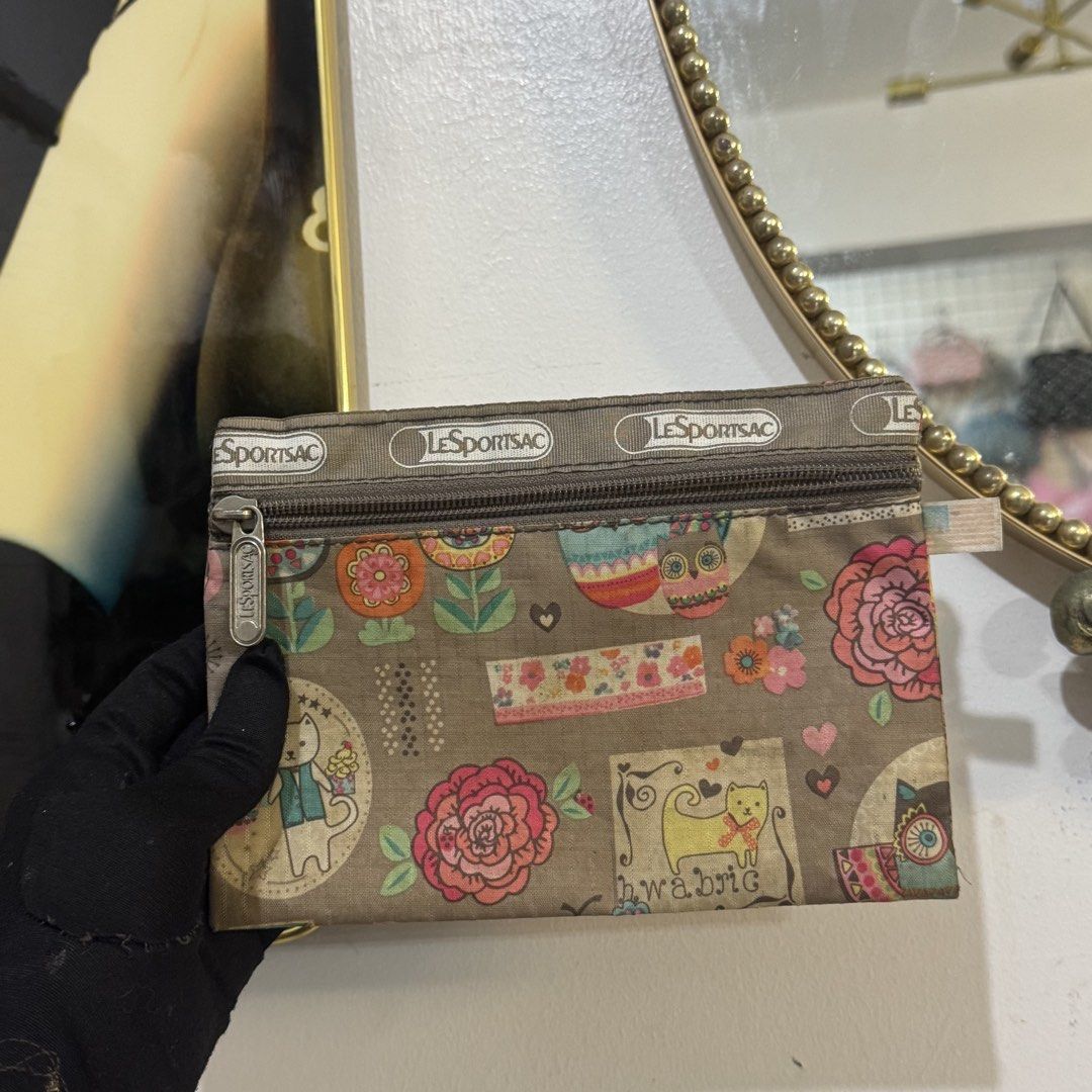 LeSportsac Cosmetic Pouch bundle (Category: Purses & Pouches) located in Rizal. Submitted by houseofbell (Listing ID 1464947805, Image 2). Description: - Authentic LeSportsac zip pouches (Set of 3) - Features 3 adorable prints: Hawaii theme, floral pattern, and whimsical cat/owl design - Secure zip closure with signature branded pull tabs - Made of lightweight, durable fabric - Perfect for organizing makeup, coins, or small essentials inside your
