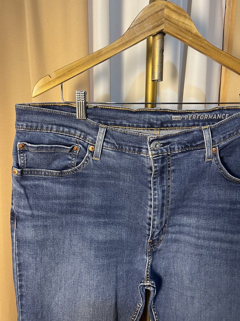 Levi's 511 Performance Slim Jeans W38 L32 (Category: Jeans) located in Kidapawan. Submitted by azythrift (Listing ID 1464917270, Image 3). Description: - Brand/Model: Levi's 511 Performance Jeans - Color/Wash: Dark Wash Blue - Fit/Style: Slim fit with stretch fabric for all-day comfort - Size: W38 L32 - Details: Classic five-pocket setup, zip fly, metal rivets, signature red tab, and leather back patch - Condition: Clean, excellent pre-loved cond