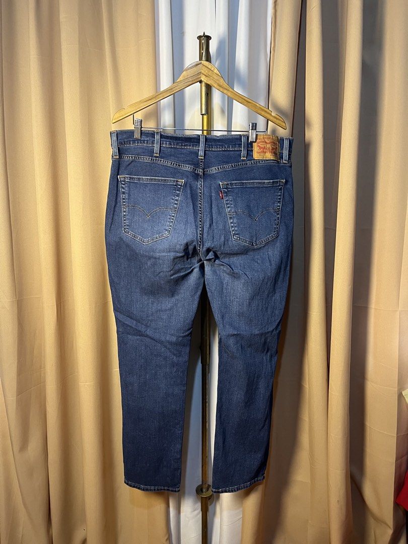 Levi's 511 Performance Slim Jeans W38 L32 (Category: Jeans) located in Kidapawan. Submitted by azythrift (Listing ID 1464917270, Image 2). Description: - Brand/Model: Levi's 511 Performance Jeans - Color/Wash: Dark Wash Blue - Fit/Style: Slim fit with stretch fabric for all-day comfort - Size: W38 L32 - Details: Classic five-pocket setup, zip fly, metal rivets, signature red tab, and leather back patch - Condition: Clean, excellent pre-loved cond