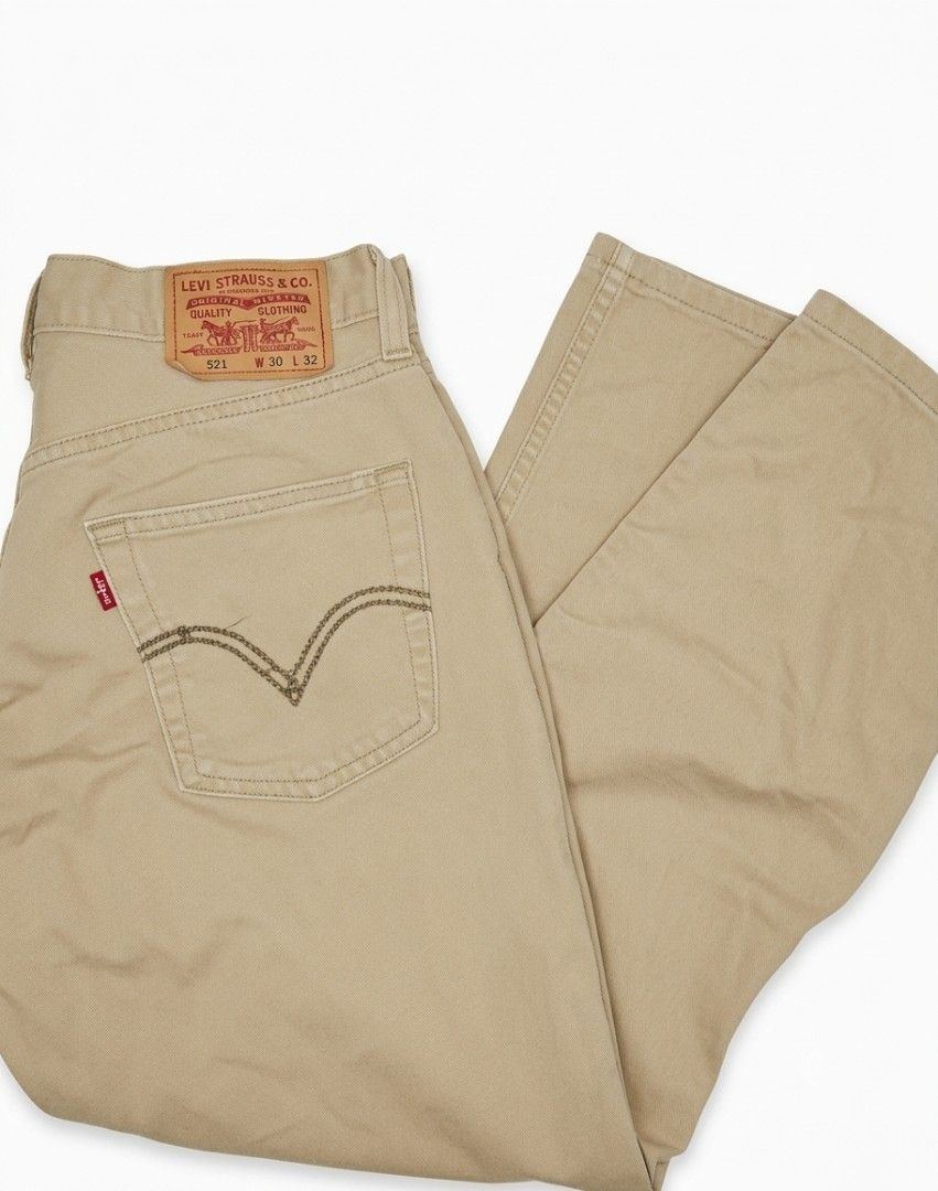 Levi's 521 Green Jeans (Category: Jeans) located in Cebu City. Submitted by safemoon-64cb (Listing ID 1464880843, Image 3). Description: - Brand: Levi's 521 - Fit: Straight leg - Color: Washed sage green - Size: Waist 30, Length 32 - Details: Classic button fly, 5-pocket design, leather back patch, and iconic red tab - Condition: Great everyday denim with a unique earth tone.