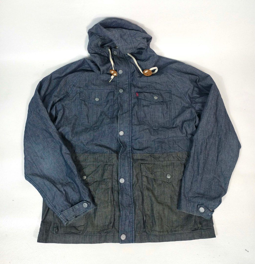 Levi's Blue Denim Hooded Jacket (Category: Coats, Jackets and Outerwear) located in Manila. Submitted by yesterdaysfinds (Listing ID 1464865341, Image 2). Description: Levis Denin SoftJacket Condition : Excellent Size : Large Dimension 👇 Chest : 22 Lenght : 29 Shoulder : 20 Sleeve : 25 📌 - Brand: Levi's - Style: Hooded denim jacket in two-tone blue and dark charcoal - Closure: Button-up front with branded metal buttons - Pockets: 4 front utilit