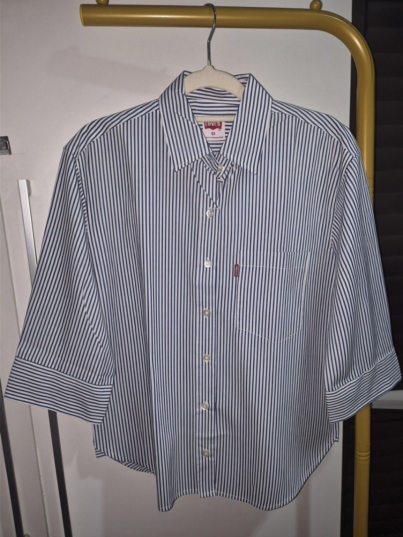 Levi's Striped Button-Up Shirts - Multiple Colors Available (Category: Shirts) located in Taguig. Submitted by chloe_clothingco. (Listing ID 1464390143, Image 3). Description: - Classic Levi's button-up shirts with extra button S-XL only - Features vertical stripes in various colorways - Chest pocket with iconic red Levi's tab - Versatile for casual or smart-casual outfits - Available in multiple sizes and colors.