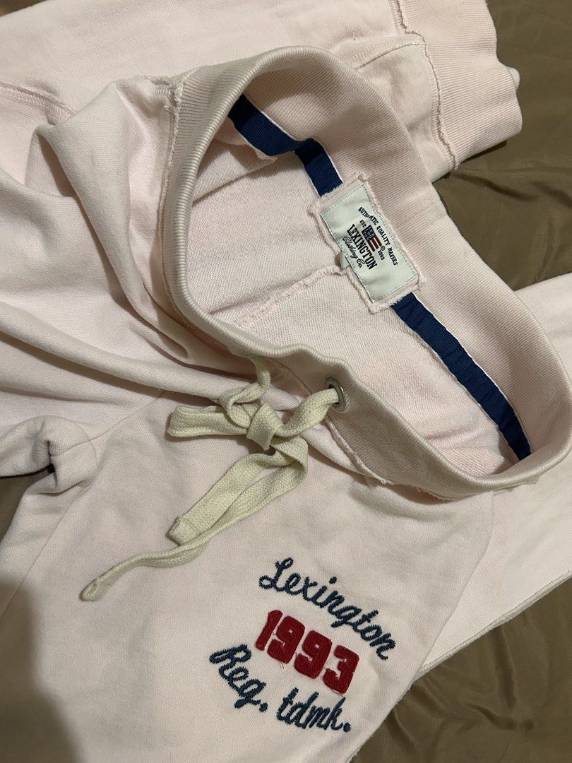 Lexington 1993 Light Pink Sweatpants (Category: Other Bottoms) located in Caloocan City. Submitted by declutterieee (Listing ID 1464851252, Image 1). Description: - Brand: Lexington Clothing Co (Est. 1993) - Color: Light pink with navy and red embroidered leg design - Material: Super comfortable fabric, ideal for lounging - Details: Elastic waistband, thick cream drawstrings, metal eyelets, cuffed ankles, and raw hem accents - Condition: Great ca