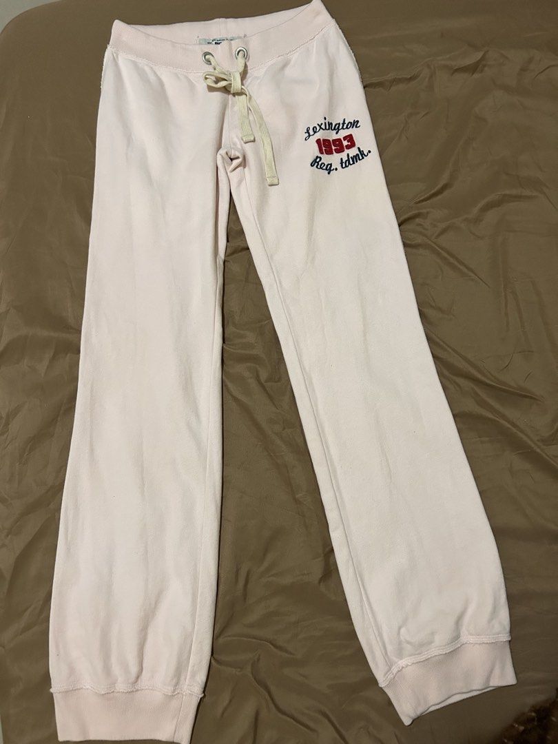 Lexington 1993 Light Pink Sweatpants (Category: Other Bottoms) located in Caloocan City. Submitted by declutterieee (Listing ID 1464851252, Image 3). Description: - Brand: Lexington Clothing Co (Est. 1993) - Color: Light pink with navy and red embroidered leg design - Material: Super comfortable fabric, ideal for lounging - Details: Elastic waistband, thick cream drawstrings, metal eyelets, cuffed ankles, and raw hem accents - Condition: Great ca