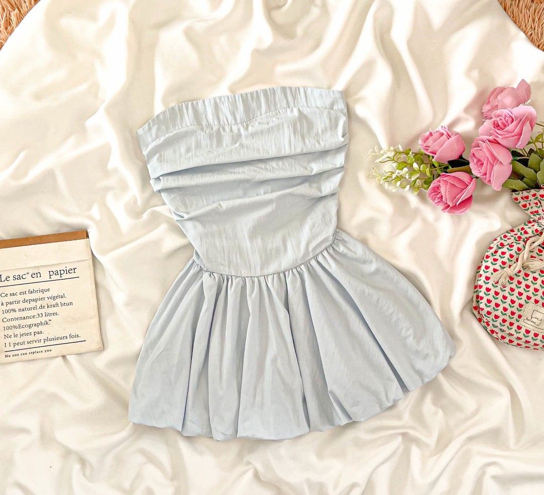 Light Blue Bubble Tube Top (Category: Sleeveless) located in Manila. Submitted by preloved_tweeds_ph (Listing ID 1464808366, Image 1). Description: small to medium - Color: Light blue - Style: Strapless top with gathered chest and flared, pleated bubble skirt - Waistline: Dropped waist - Fabric: Lightweight and airy, perfect for warm weather - Versatility: Great for garden parties or casual hangouts; easy to style with sandals or sneakers - Condi