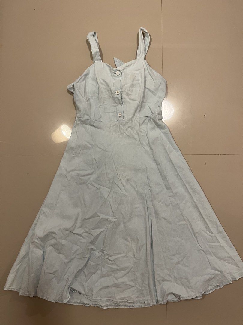 Light Blue Midi Dress with Button Front and Bow Back (Category: Dresses) located in Koronadal. Submitted by keenpenguin_6af0c6 (Listing ID 1464905036, Image 1). Description: - Color: Light blue - Length: Midi (hits below the knees) - Material: Lightweight and breathable - Design: Thick shoulder straps, 3 decorative white front buttons, and a flared A-line skirt - Fit: Built-in back elastic band with a matching adjustable tie-back bow - Occasion: 