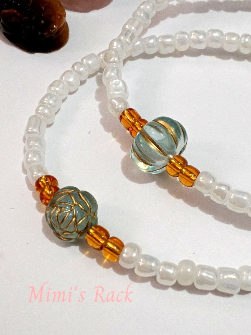 Light Blue Marrakech Pumpkin & Rose White Seed Bead Bracelet (Category: Bracelets) located in Taguig. Submitted by mimisrack (Listing ID 1464890290, Image 1). Description: 🩵A sweet and delicate white seed bead bracelet featuring charming light blue pumpkin and rose charms with beautiful gold-tone detailing. The soft blue charms against the white beads create a lovely, feminine look with a touch of vintage-inspired charm. ✨ -A unique little brace