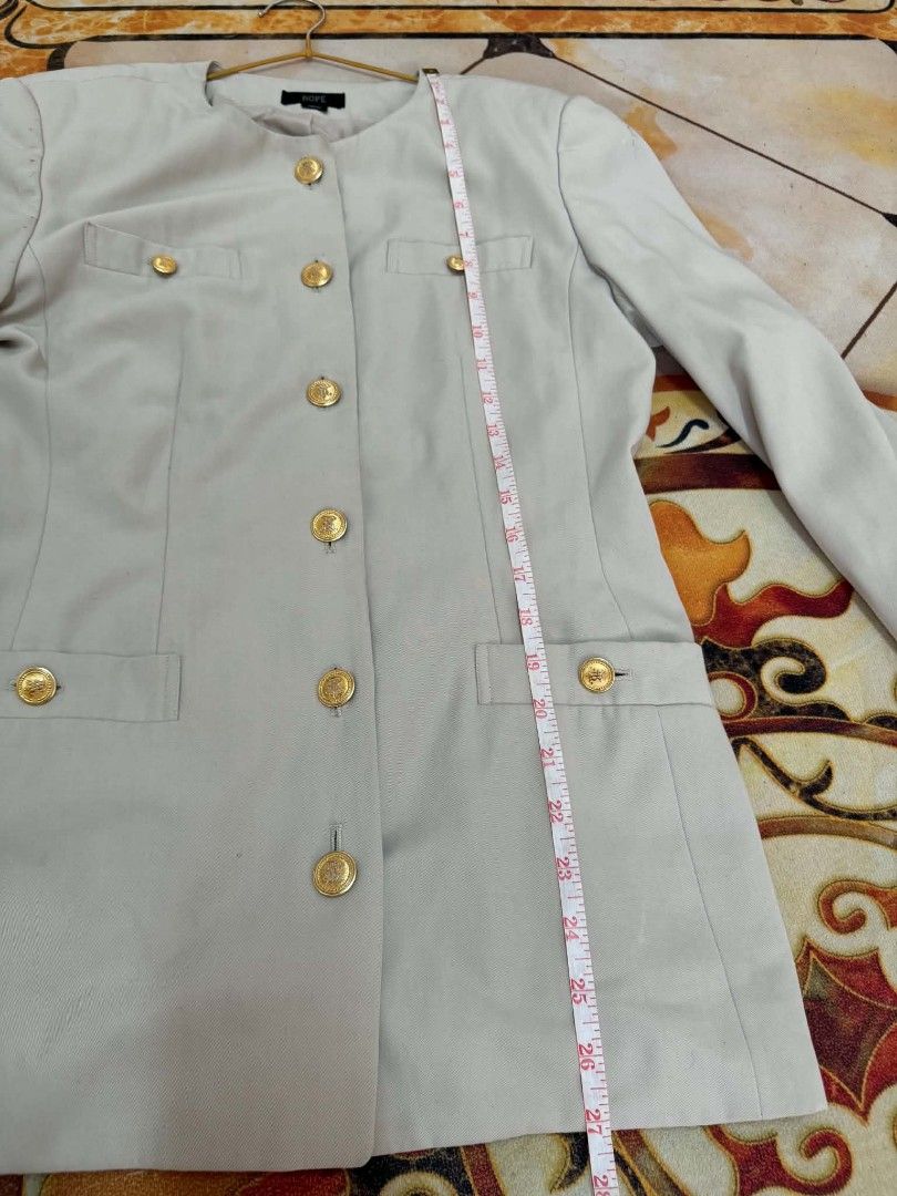 Light grey Crew Neck Blazer with Gold Buttons (Category: Coats, Jackets and Outerwear) located in Caloocan City. Submitted by mylove326 (Listing ID 1464926424, Image 3). Description: - Brand: ROPE - Style: Crew neck structured blazer - Color: Classic beige - Details: Statement gold front buttons, flap chest pockets, and lower flap pockets - Sleeves: Long with matching cuff buttons - Versatility: Ideal for professional workwear and smart casual ou