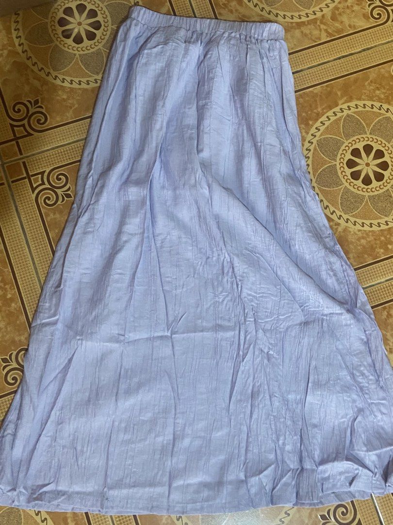 Light Purple Long Crinkled Maxi Skirt (Category: Skirts) located in Baguio. Submitted by sasissey (Listing ID 1464902739, Image 2). Description: - Color: Pastel lilac / light purple - Material: Lightweight crinkled fabric with a flowy drape - Waistband: Very stretchy elastic for all-day comfort - Style: Long maxi length, easy to pair with basic tops or blouses - Condition: Brand new / excellent (ready to wear).