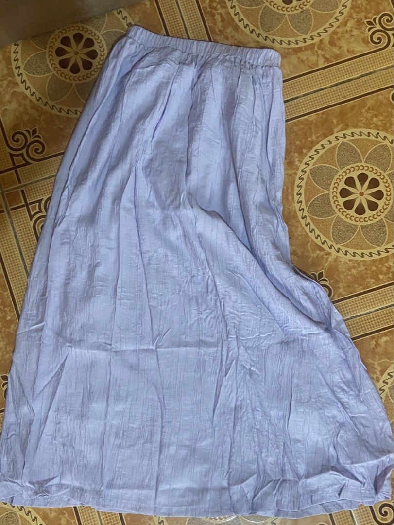 Light Purple Long Crinkled Maxi Skirt (Category: Skirts) located in Baguio. Submitted by sasissey (Listing ID 1464902739, Image 1). Description: - Color: Pastel lilac / light purple - Material: Lightweight crinkled fabric with a flowy drape - Waistband: Very stretchy elastic for all-day comfort - Style: Long maxi length, easy to pair with basic tops or blouses - Condition: Brand new / excellent (ready to wear).