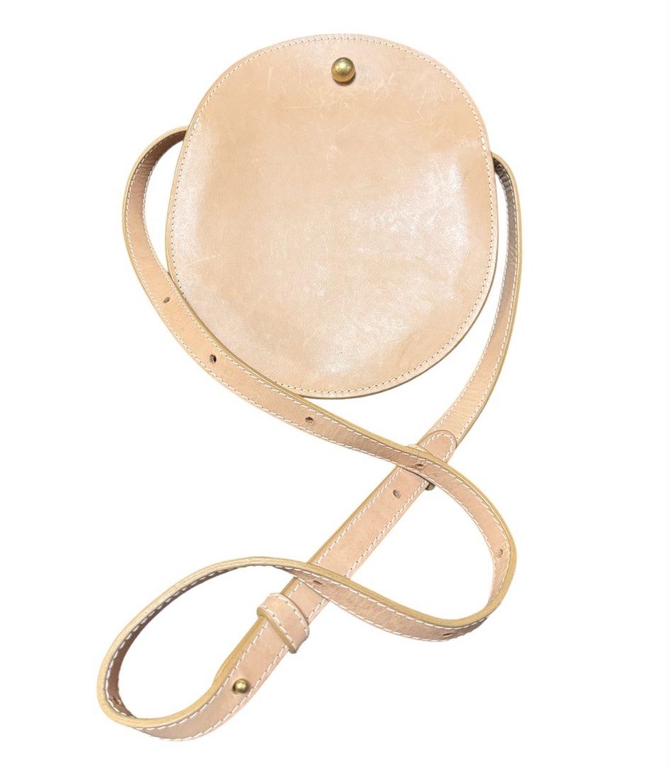 Lindquist Round Leather Shoulder Bag (Category: Cross-body Bags) located in Baguio. Submitted by pwz-eshop (Listing ID 1464827418, Image 1). Description: • Up for Grabs!! • Flaws: Oil Marks on leather. (please see photos) • Guaranteed Authentic! • BRAND: LINDQUIST. • DIMENSIONS: length 8.5", height 9.75", width 1.75", handle drop: 19.5". • SERIAL NUMBER: 3LKCE ZJMI. • COUNTRY OF ORIGIN: Undetermined. • MATERIAL: Leather. • COLOR: Tan. • Lining: L