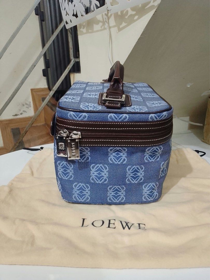 Loewe Blue Denim Anagram Vanity Bag (Category: Luxury Bags & Wallets) located in Quezon City. Submitted by luxuriesbymichiika (Listing ID 1464898644, Image 3). Description: - Authentic Loewe vanity bag in classic blue denim with iconic Anagram pattern - Accented with dark brown leather trim, top handle, and polished silver hardware - Secure zipper closure featuring engraved Loewe zip pulls - Structured design with ample space for daily essentials