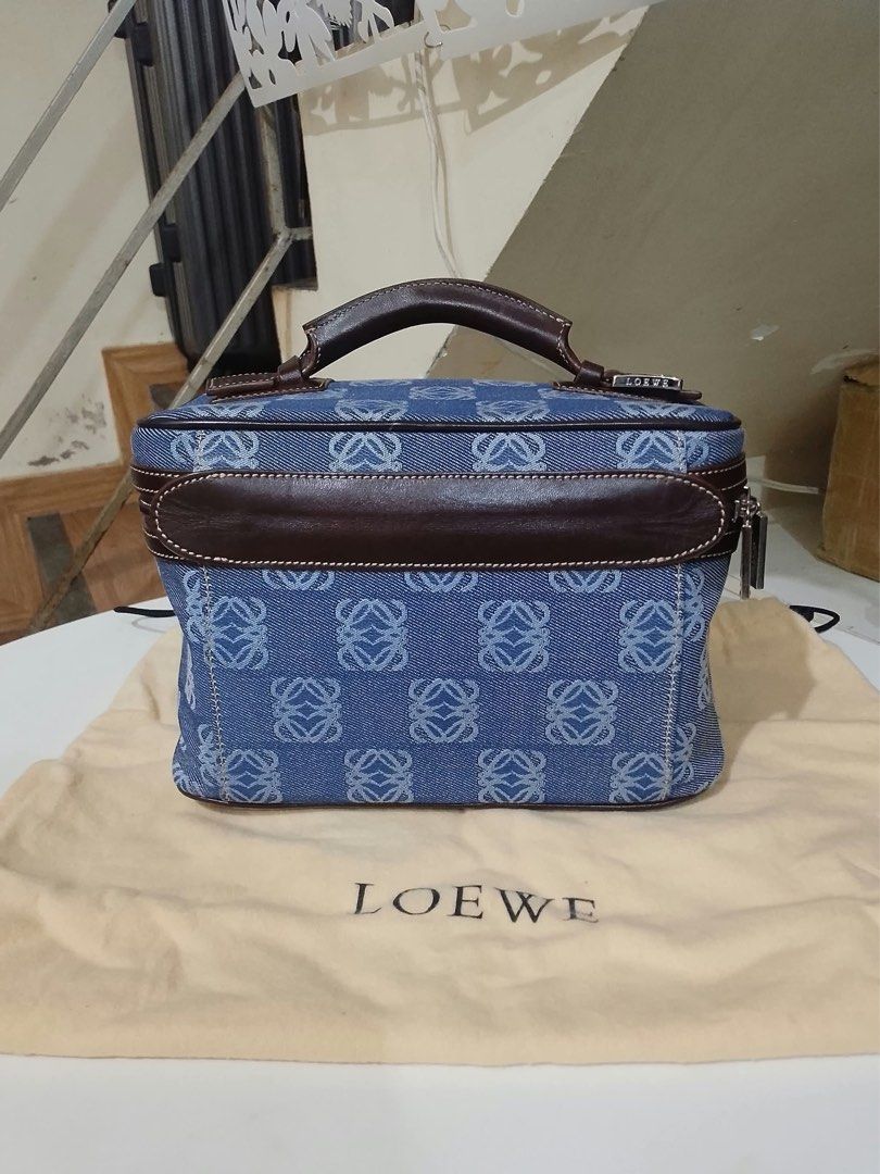 Loewe Blue Denim Anagram Vanity Bag (Category: Luxury Bags & Wallets) located in Quezon City. Submitted by luxuriesbymichiika (Listing ID 1464898644, Image 1). Description: - Authentic Loewe vanity bag in classic blue denim with iconic Anagram pattern - Accented with dark brown leather trim, top handle, and polished silver hardware - Secure zipper closure featuring engraved Loewe zip pulls - Structured design with ample space for daily essentials