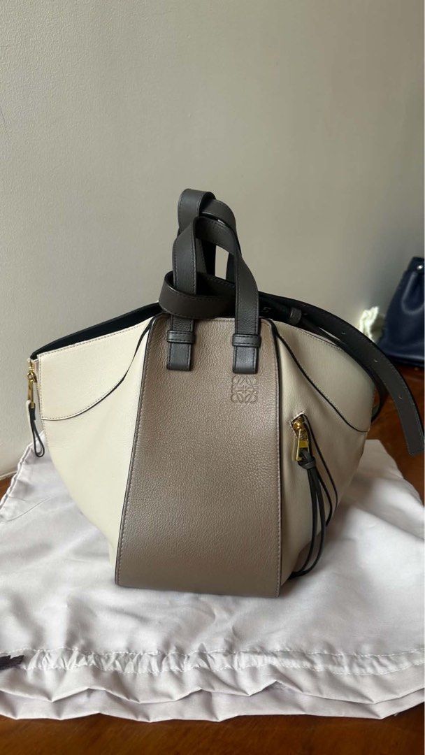 Loewe Hammock (Category: Luxury Bags & Wallets) located in Muntinlupa City. Submitted by mabelleadr46801 (Listing ID 1464832422, Image 1). Description: ✨ LOEWE TRICOLOR HAMMOCK BAG ✨ Selling this gorgeous, authentic Loewe Hammock bag in the perfect neutral tricolor palette (cream, taupe, and dark espresso accents). It’s the ultimate chameleon bag—you can zip the sides or expand them to completely change the shape from a structured tote to a relax