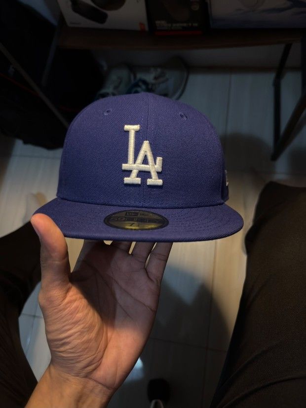 Los Angeles Dodgers MLB AC Perf Blue 59FIFTY Fitted Cap (ESSENTIAL) (Category: Caps & Hats) located in Manila. Submitted by beyondthespotlight (Listing ID 1464891043, Image 1). Description: Brand: Official New Era 59FIFTY Size: 7 1/4 Color: Classic blue with white details.
