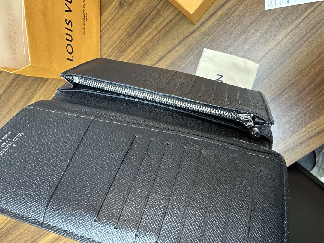 Louis Vuitton Brazza Wallet Damier Graphite (Category: Luxury Bags & Wallets) located in Binan City. Submitted by itiantimbol27 (Listing ID 1464805606, Image 3). Description: - Brand: Louis Vuitton - Model: Brazza Wallet - Material: Damier Graphite Canvas with Black Taiga Leather Interior - Features: Multiple card slots, bill compartments, and zippered coin pocket - Condition: Clean inside and out, ready for daily carry - Provenance: Purchased fr