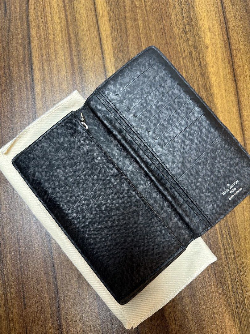 Louis Vuitton Brazza Wallet Damier Graphite (Category: Luxury Bags & Wallets) located in Binan City. Submitted by itiantimbol27 (Listing ID 1464805606, Image 2). Description: - Brand: Louis Vuitton - Model: Brazza Wallet - Material: Damier Graphite Canvas with Black Taiga Leather Interior - Features: Multiple card slots, bill compartments, and zippered coin pocket - Condition: Clean inside and out, ready for daily carry - Provenance: Purchased fr