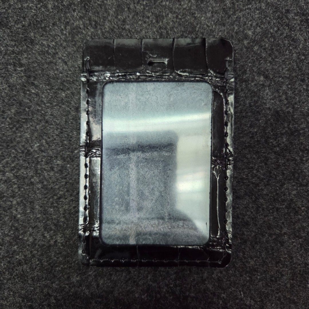 Louis Vuitton Crocodile leather ID case (Category: Wallets & Card holders) located in Quezon City. Submitted by dexter0381 (Listing ID 1464959485, Image 3). Description: - Color & Material: Premium black LV Crocodile leather - Design: Practical clear ID window on one side and a clean back panel with subtle brand lettering - Durability: Neatly stitched edges all around for added strength - Fit: Compact size that easily holds standard IDs and cards