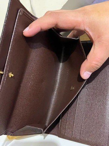 Louis Vuitton Damier Ebene Long Wallet (Category: Luxury Bags & Wallets) located in Quezon City. Submitted by luxuriesbymichiika (Listing ID 1464902835, Image 2). Description: - Authentic Louis Vuitton long wallet in iconic Damier Ebene canvas - Secure gold-tone snap button closure - Features multiple card slots and spacious flat compartments - Premium dark brown cross-grain leather lining - Includes original dust bag - Condition: Minor wear alon
