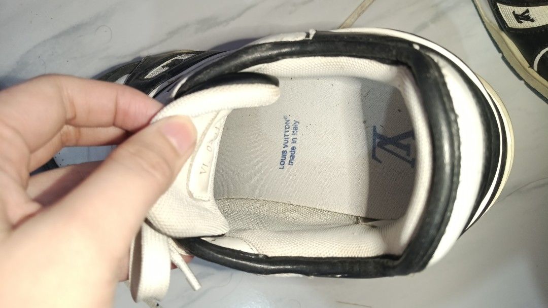 Louis Vuitton LV Trainer Black White (Category: Sneakers & Footwear) located in Manila. Submitted by ysabelgale09807 (Listing ID 1464802613, Image 3). Description: - Brand: Louis Vuitton - Model: LV Trainer Sneakers - Colorway: Classic Black and White - Origin: Made in Italy - Details: Signature LV initials, perforated toe box, lace-up design, chunky rubber sole - Condition: Normal signs of wear on leather uppers and midsoles from regular use - S