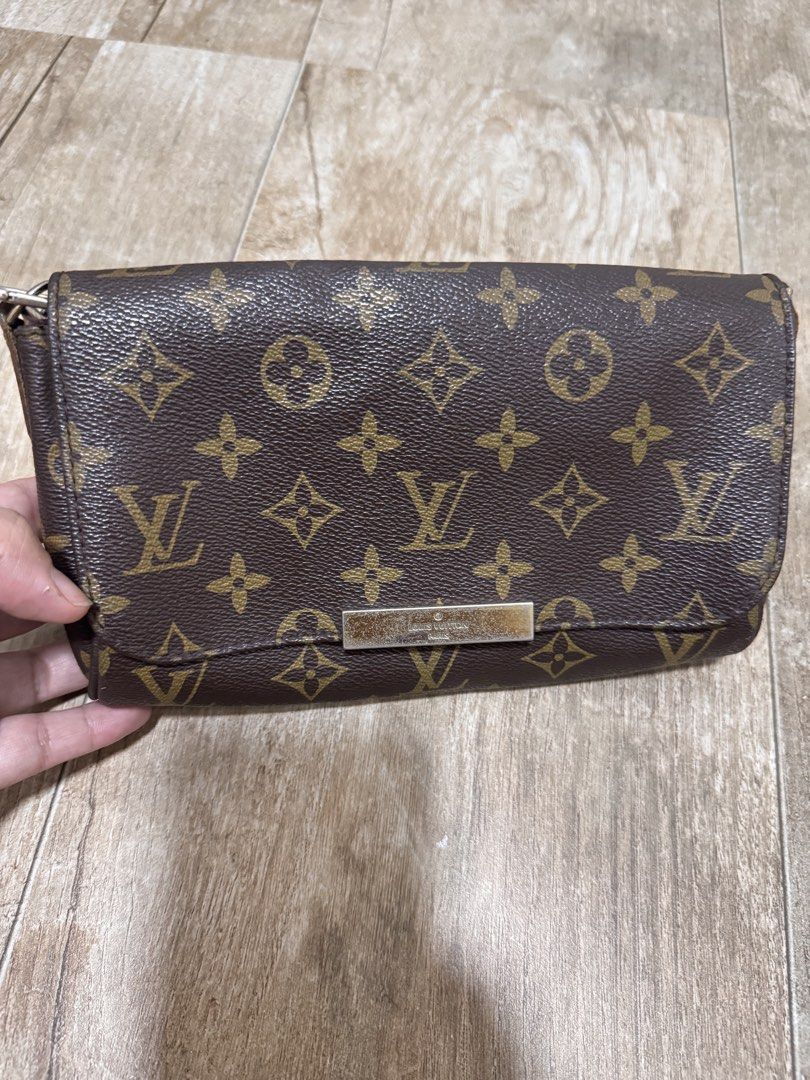Louis Vuitton Monogram Canvas Shoulder Bag (Category: Luxury Bags & Wallets) located in Pasig City. Submitted by sdpii (Listing ID 1464770491, Image 1). Description: - Louis Vuitton monogram canvas flap bag in dark brown - Chic silver-tone hardware with a secure metal clasp closure - Spacious brown textile interior lining complete with brand patch label - Includes a versatile, detachable thin leather strap with stylish contrast yellow stitching -